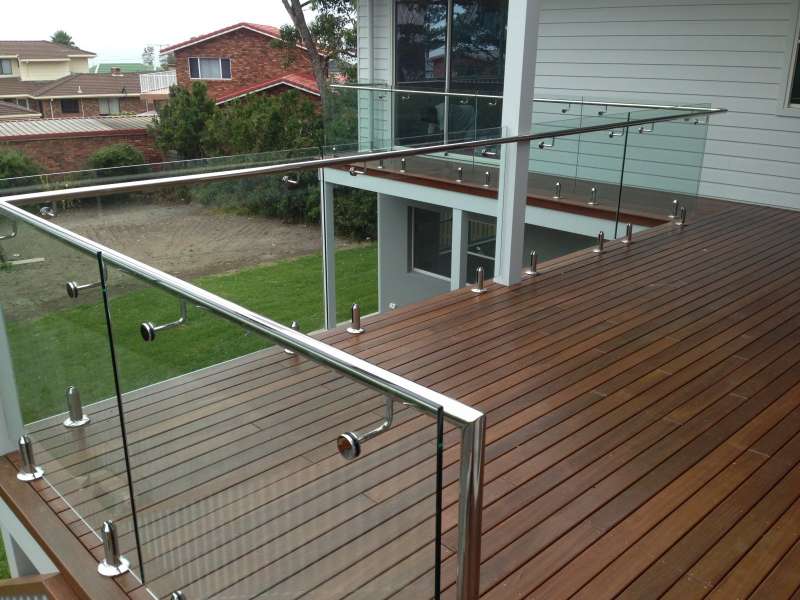 Stainless steel handrails on frameless glass.